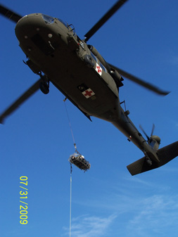 EE hanging from the rescue Blackhawk
